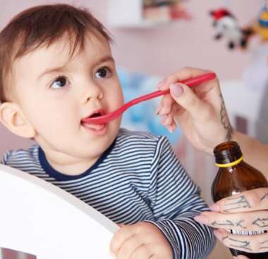 baby taking medicine