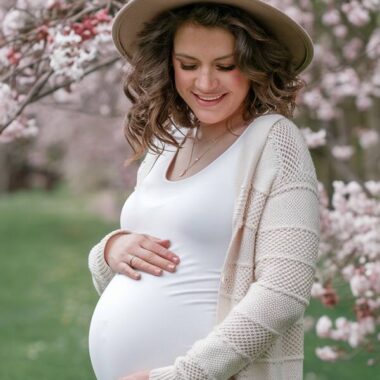 pregnant woman in spring in a cardigan